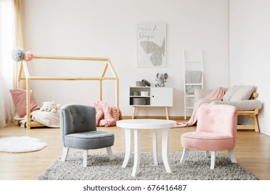 Grey And Pink Small Cute Chairs Standing On Soft Carpet In Cozy Baby Room