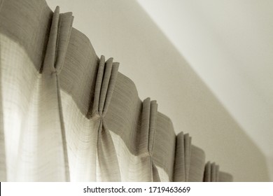 Grey Pleated Curtain Detail On Wall