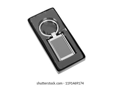 Grey Rectangle Chrome Metal Key Chain In Black Paper Box Isolated On White Background.