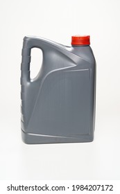 Grey With A Red Lid Canister With Machine Oil On A White Background. Motor Oils To Reduce Friction Between Moving Engine Parts. Car Service And Shop