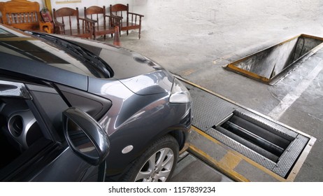 A Grey Sedan Car Is About To Get Inspected At Vehicle Inspection Service Center To Support Law Required Annual Insurance Renewal And Tax Payment 