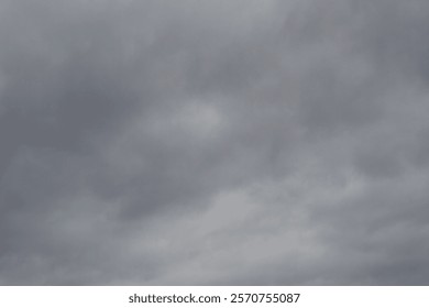 A grey sky with clouds