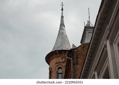 A Grey Spire On The Top Of Historical Building In The City. Province. Town. Urban. State. Peak. Pinnacle. Steeple. Journey. Spectacular. Passion. Twilight. Vitality. History. Exotic