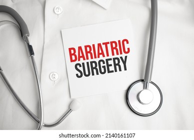 Grey Stethoscope And Paper Plate With A Sheet Of White Paper With Text Bariatric Surgery Light Blue Backround. Medical Concept.