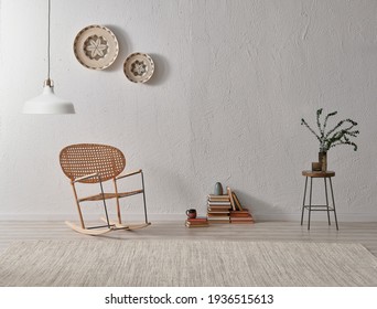 Grey stone wall background, wicker chair and frame style with lamp decoration, vase of plant book.