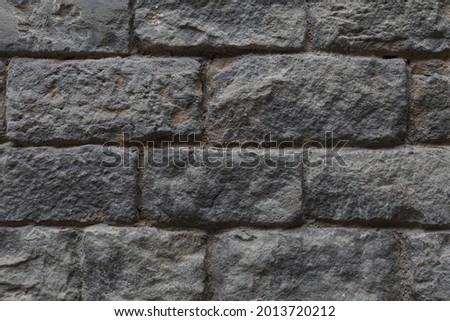 Grey stone wall brick texture, rough ashlar background