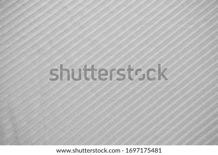 grey striped fabric. the lines are parallel. pattern and background.