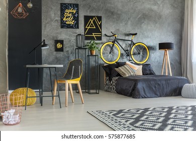 Grey Student Room With Bed, Desk, Bike And Copper Lamps