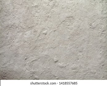 Grey surface texture of construction dust covering the floor creates a health risk for construction workers. Construction health risk environment concept. OSHA
