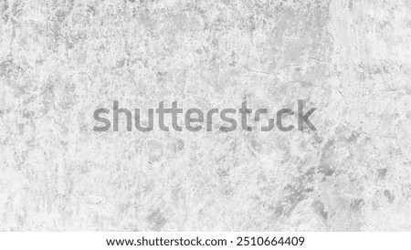A grey wall abctract texture background with a few scratches and marks. The wall is very plain and has no decoration