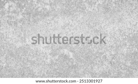 A grey wall abctract texture background with a few scratches and marks. The wall is very plain and has no decoration