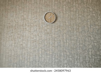 grey wall with clock on it