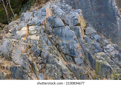 Greywacke In Various Colors And Shades As A Sedimentary Rock Formation In The Harz Mountains