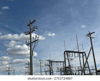 Grid infrastructure and transmission framework structures rising across open prairie sky in rural Alberta energy corridor.