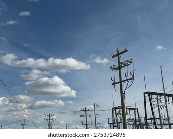 Grid infrastructure and transmission framework structures rising across open prairie sky in rural Alberta energy corridor.