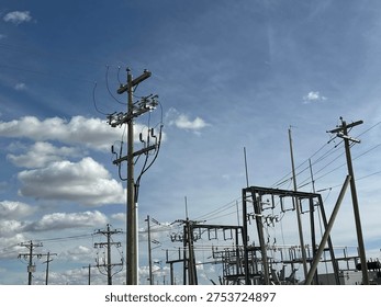 Grid infrastructure and transmission framework structures rising across open prairie sky in rural Alberta energy corridor.