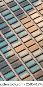 A grid of rectangular windows reflects a calming gradient of blue and beige hues, creating a harmonious and structured visual rhythm.