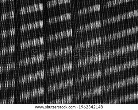 Grid shadow on textile surface                            