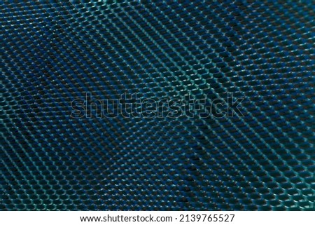 Grid structure of wall with dotted elementrs. Abstract architecture background. Close-up of modern industrial or hi-tech building exterior. Regular geometric pattern with rows and parallel lines.