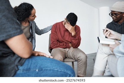 Grief, meeting and support group with people in circle together for communication, depression or mental health. Crying, therapy or trust with man and woman friends in studio for psychology consulting - Powered by Shutterstock