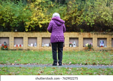 Grieving Widow On A Graveyard