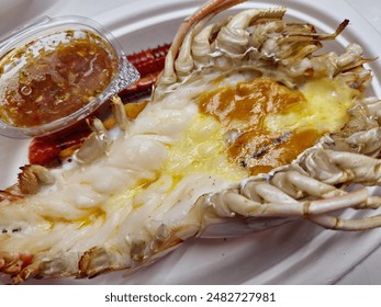 Griiled Split Open Large River Prawn with Seafood Sauce Closeup Image.