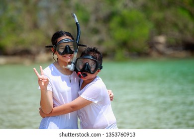 Gril And Boy With Snorkle  In The Beautiful Sea Are Happy