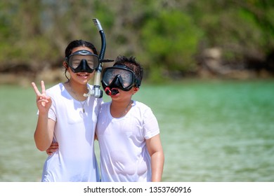 Gril And Boy With Snorkle  In The Beautiful Sea Are Happy