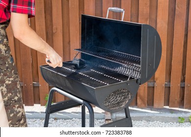 Grill Barbecue In The Backyard - Cleaning