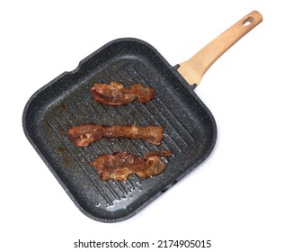 Grill Frying Pan With Cooked Bacon Rashers On White Background