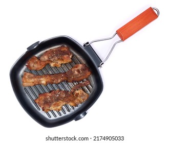 Grill Frying Pan With Cooked Bacon Rashers On White Background