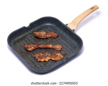 Grill Frying Pan With Cooked Bacon Rashers On White Background