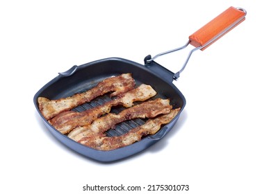 Grill Frying Pan With Cooked Bacon Rashers On White Background