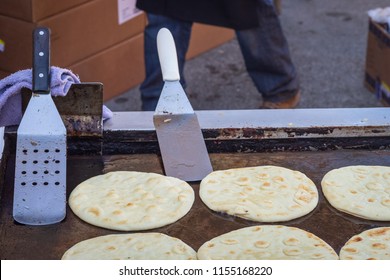 Grill With Naan Bread Being Cooked At An Outdoor Food Truck Festival