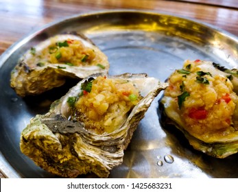 Grill Oysters With Shredded Garlic. Guangdong Food