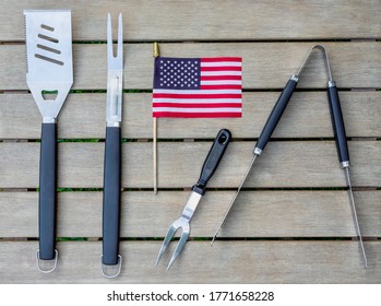 Grill Tools On A Outdoor Table In The Backyard Ready For A Summer Barbecue