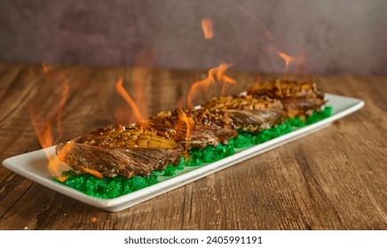 Grilled Abadone with flame on top 