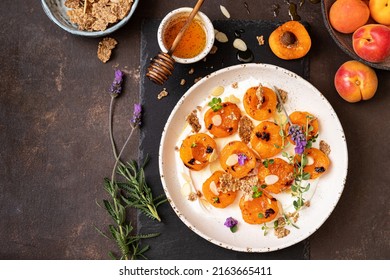 Grilled apricots with Greek yogurt, granola and honey. Summer breakfast - Powered by Shutterstock