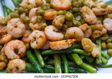 Grilled Asparagus, Shrimp And Pea Salad For Lunch On A White Plate