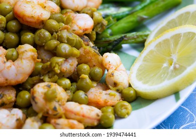 Grilled Asparagus, Shrimp And Pea Salad For Lunch On A White Plate