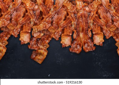 Grilled Bacon On Black Background.