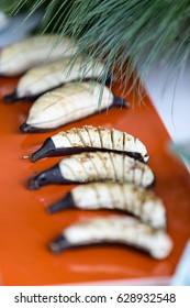 Grilled Banana Foster On Brown Plate