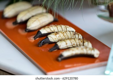 Grilled Banana Foster On Brown Plate