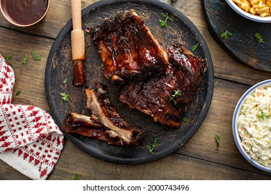 Grilled Barbeque Ribs With BBQ Sauce With Mac And Cheese And Coleslaw