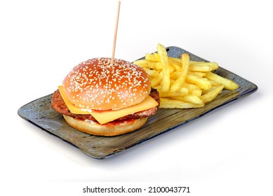 Grilled Beef Burger In A Toasted Burger Bun And Served With Fries