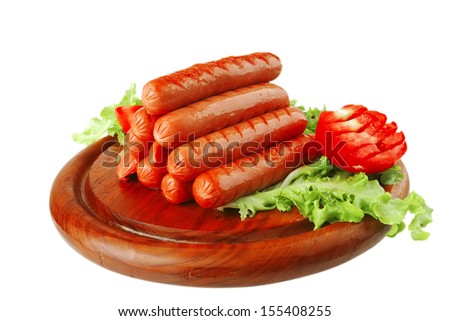 grilled beef red sausages on wooden plate