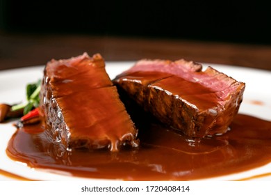 Grilled Beef Steak Filet Mignon Medium Rare Pour Demi-glace Sauce