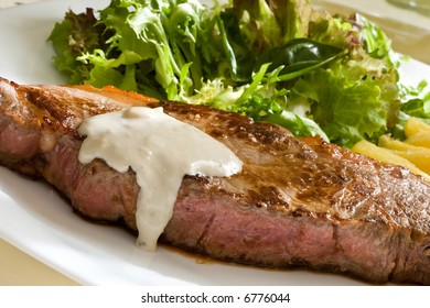 Grilled Beef Steak With Green Salad And Blue Cheese Sauce