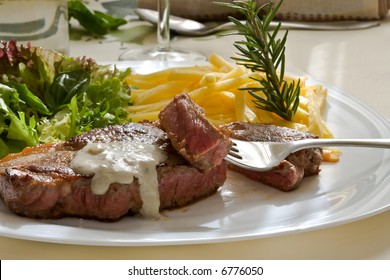 Grilled Beef Steak With Green Salad And Blue Cheese Sauce