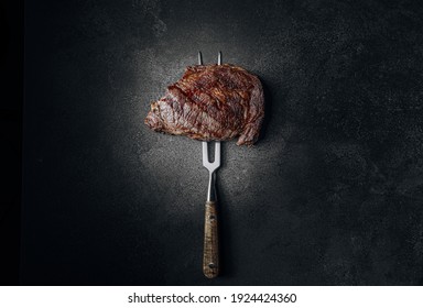 grilled beef steak on a dark background. expensive marbled beef of the highest grade fried to rare on the grill - Shutterstock ID 1924424360